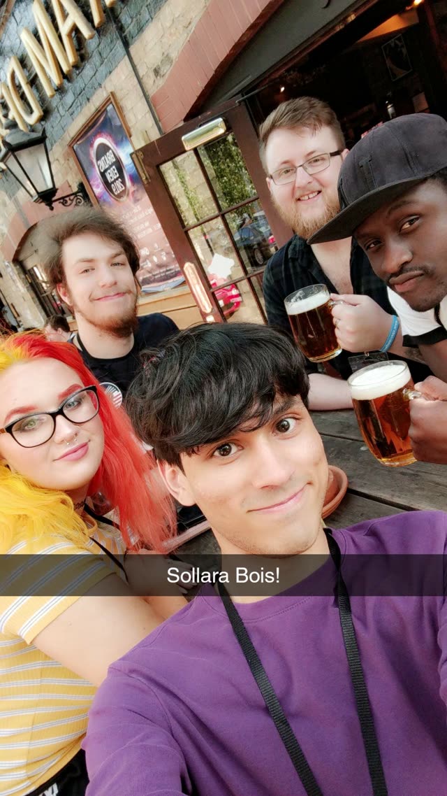Team Sollara posing together with drinks, captioned 'Sollara Bois!'