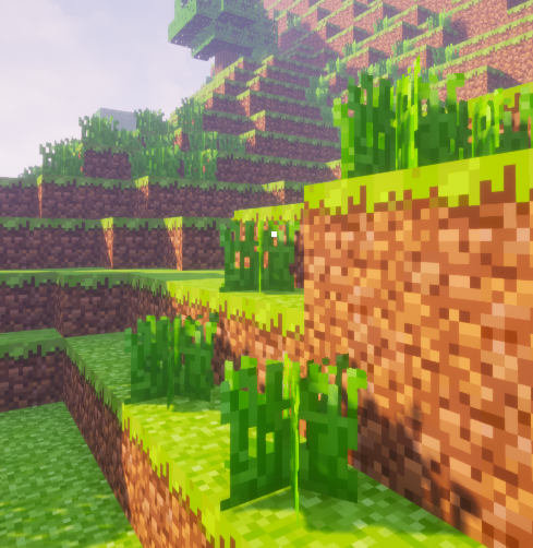 Dense instanced grass rendered across the voxel terrain